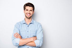man crossing arms and smiling