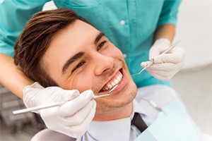 man getting gum disease treatment