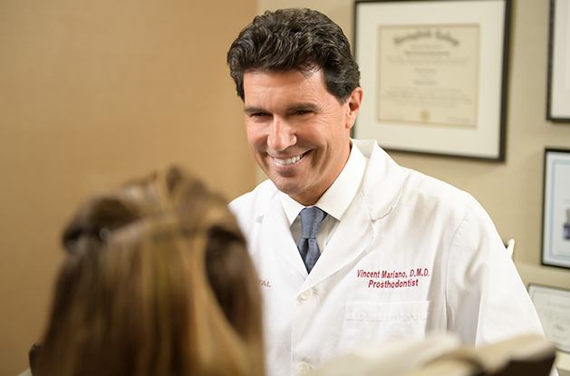 Dr. Mariano smiling at patient