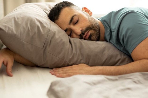Man sleeping peacefully in bed