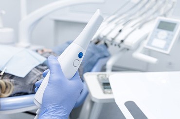 a dentist holding an impression wand