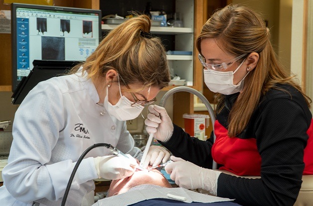 Dentist doing thorough dental exams