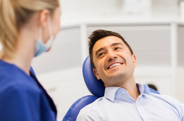 man laying back in exam chair