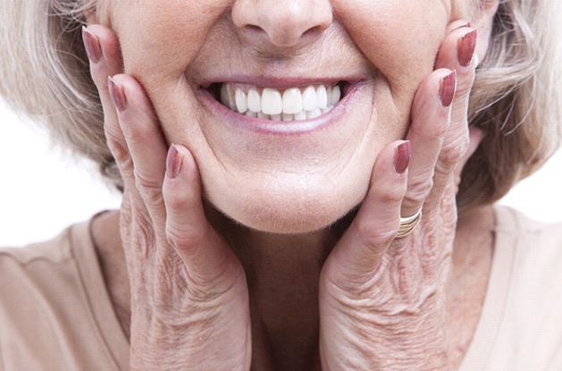 patient smiling with dentures in East Longmeadow