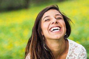 woman laughing in field