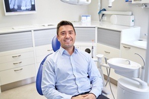 man in light blue shirt smiling