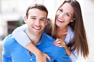 boyfriend giving girlfriend piggyback ride