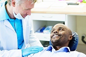 man looking at dentist