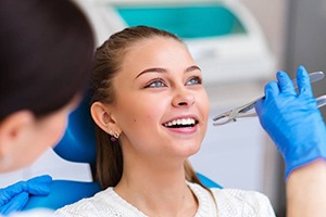 girl getting tooth extraction