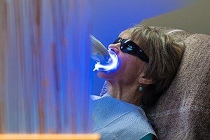 woman in teeth whitening process