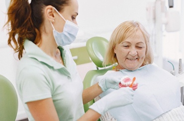 Woman seeing dentist in East Longmeadow & Northampton