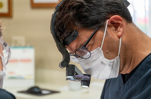 dentist working on implant dentures