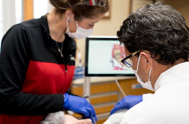 dentist addind dentures and dental implants