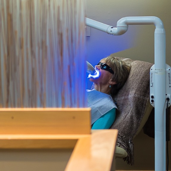 Woman getting teeth whitening in Northampton and East Longmeadow dental office