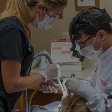 emergency dentists working on patient