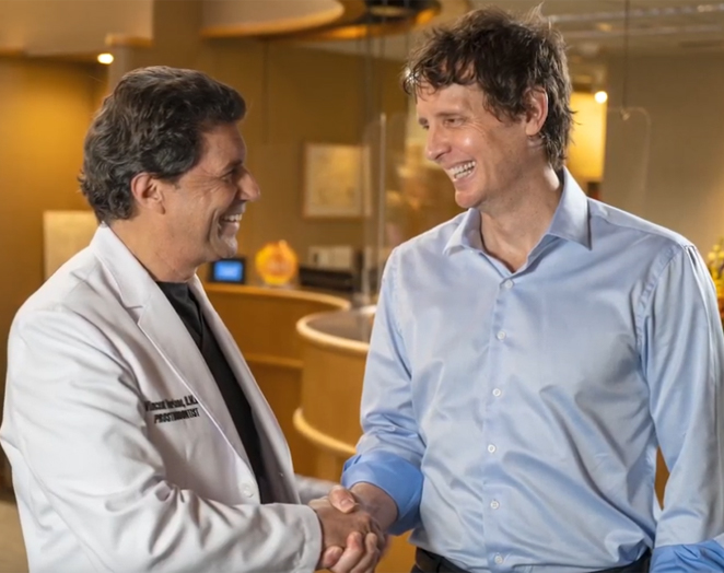 Man shaking hands with his dentist in East Longmeadow and Northampton