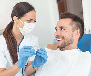 patient and dentist discussing the cost of Invisalign in East Longmeadow