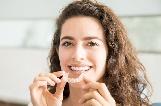 woman putting in tray