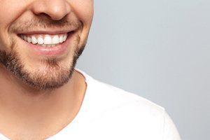 man in white shirt smiling