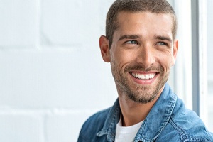 handsome man with shaved head smiling