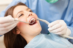 teen girl getting fluoride treatment