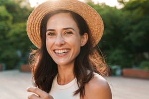woman wearing hat smiling