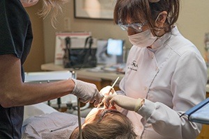 female dentist working