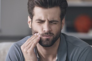 handsome man with beard in pain