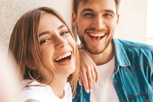 couple laughing looking at camera