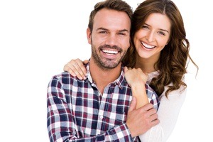 man holding womans arm smiling together
