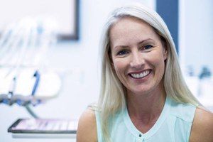 woman wearing tank top smiling