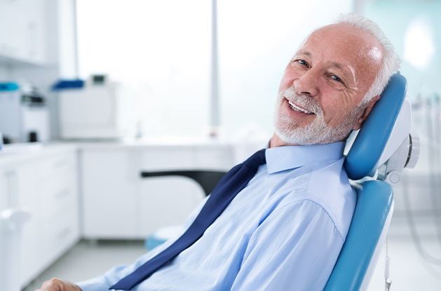 man in business attire in exam chair