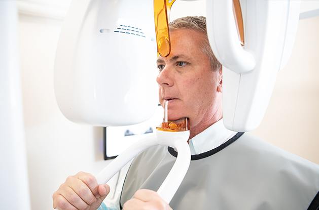 Man in cone beam scanner