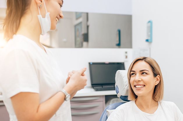 team member talking to female patient