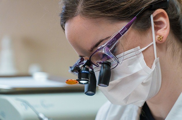 dentist with micro glasses on