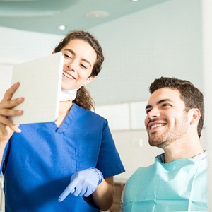 Dentist reviewing pricing information with patient