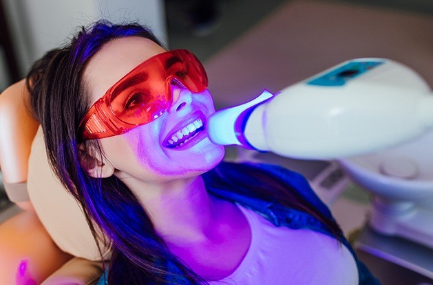 Woman smiling after teeth whitening in Northampton