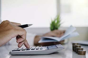 Man calculating cost of teeth whitening in Northampton