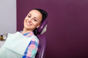 Woman smiling in dental chair during routine dental visit