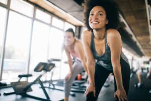 a person smiling during a workout class