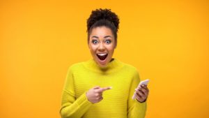 woman smiling with cell phone