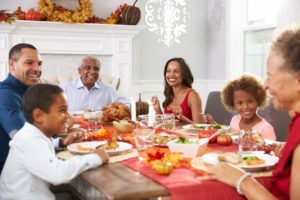 A family enjoying a meal with dental implants in East Longmeadow & Northampton