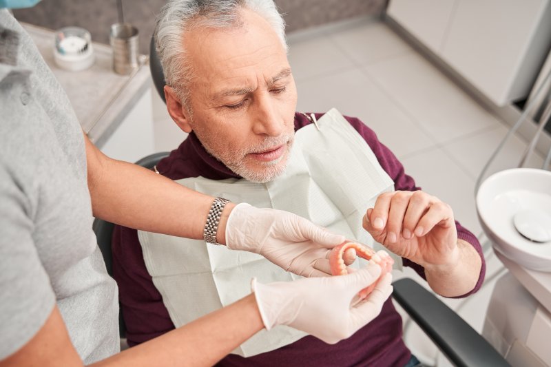 Man considering dentures and taste