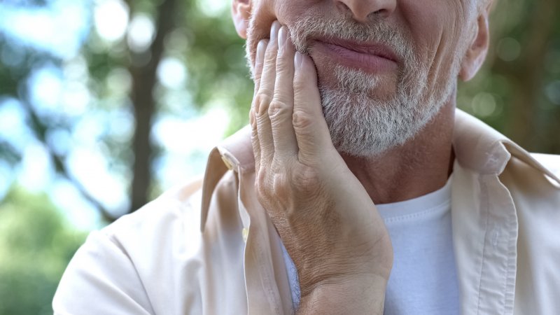 An older man with jaw pain on one side
